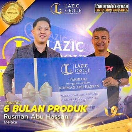 High-quality image of Dinara holding a Lazic Group award and product voucher in Melaka for SEO relevance.